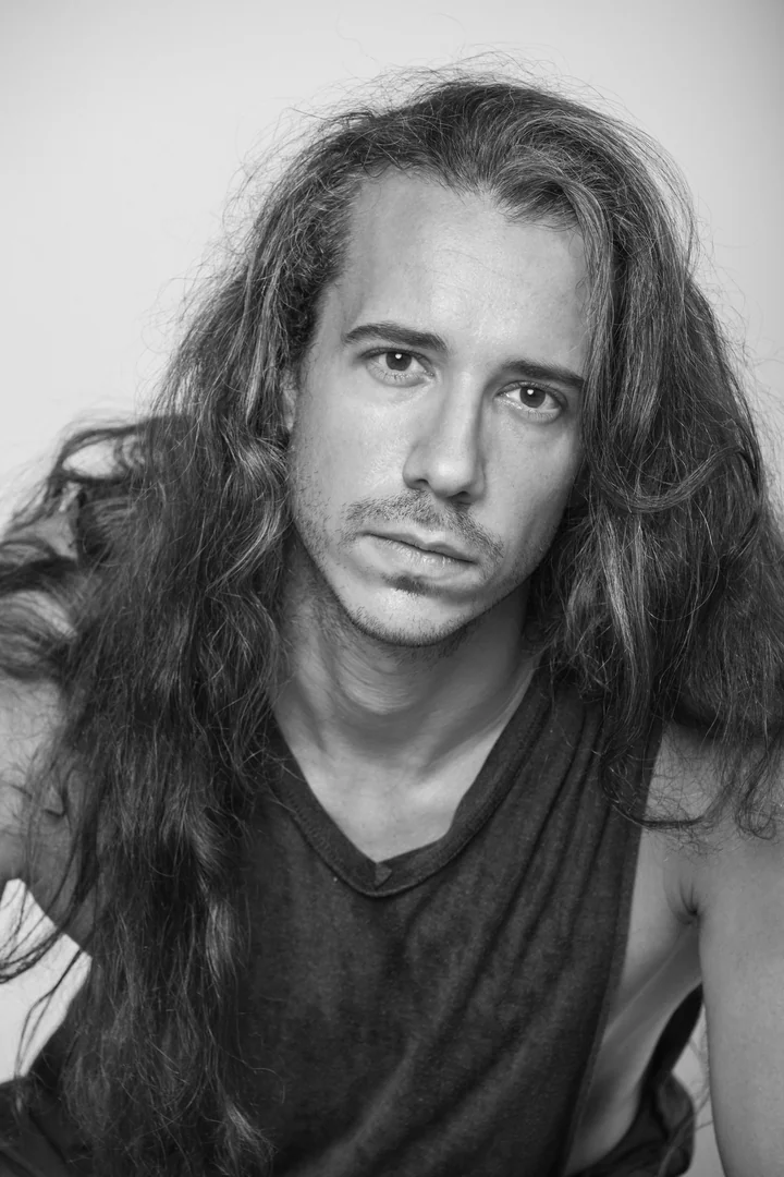 Black-and-white close-up of Zeyan with long, loose hair.